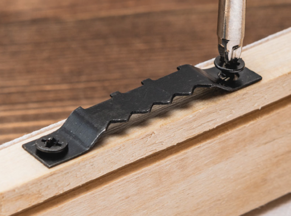 4. Attach a sawtooth bracket to your canvas